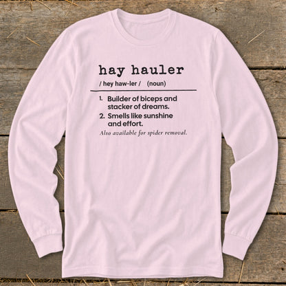 Pink long-sleeved shirt with definition of "hay hauler" text.