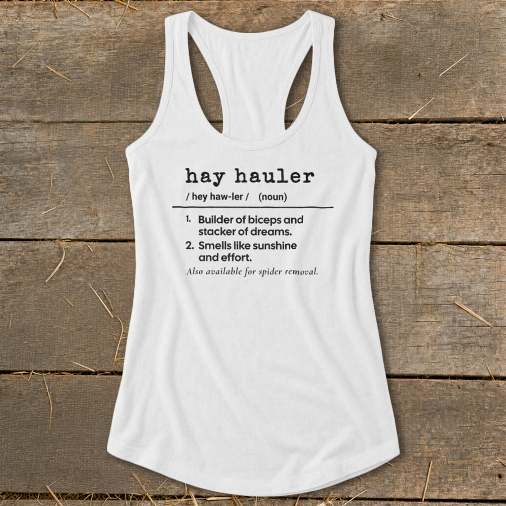 White tank top with "hay hauler" definition and spider removal note.