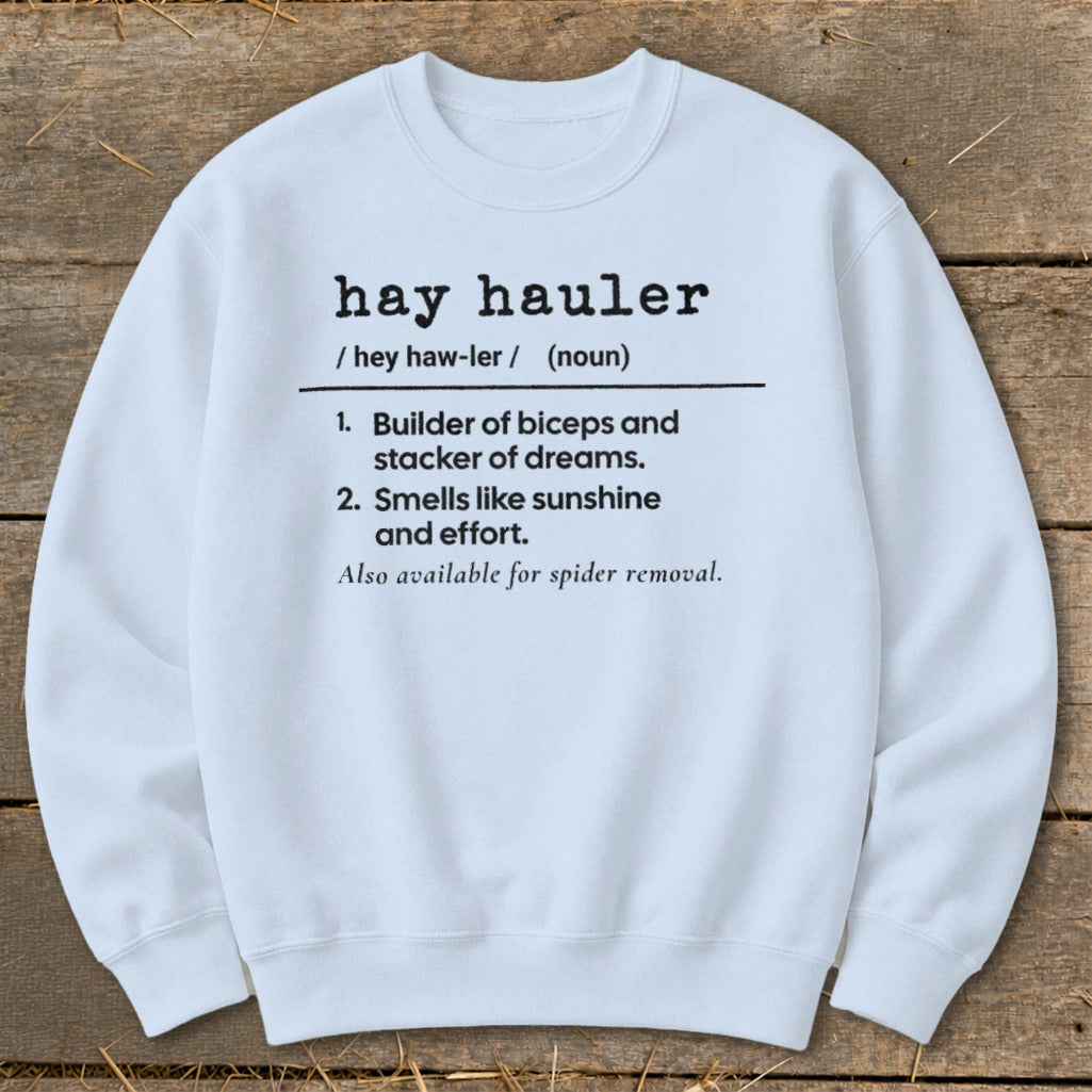 White crewneck sweatshirt with "hay hauler" definition text printed on the front.
