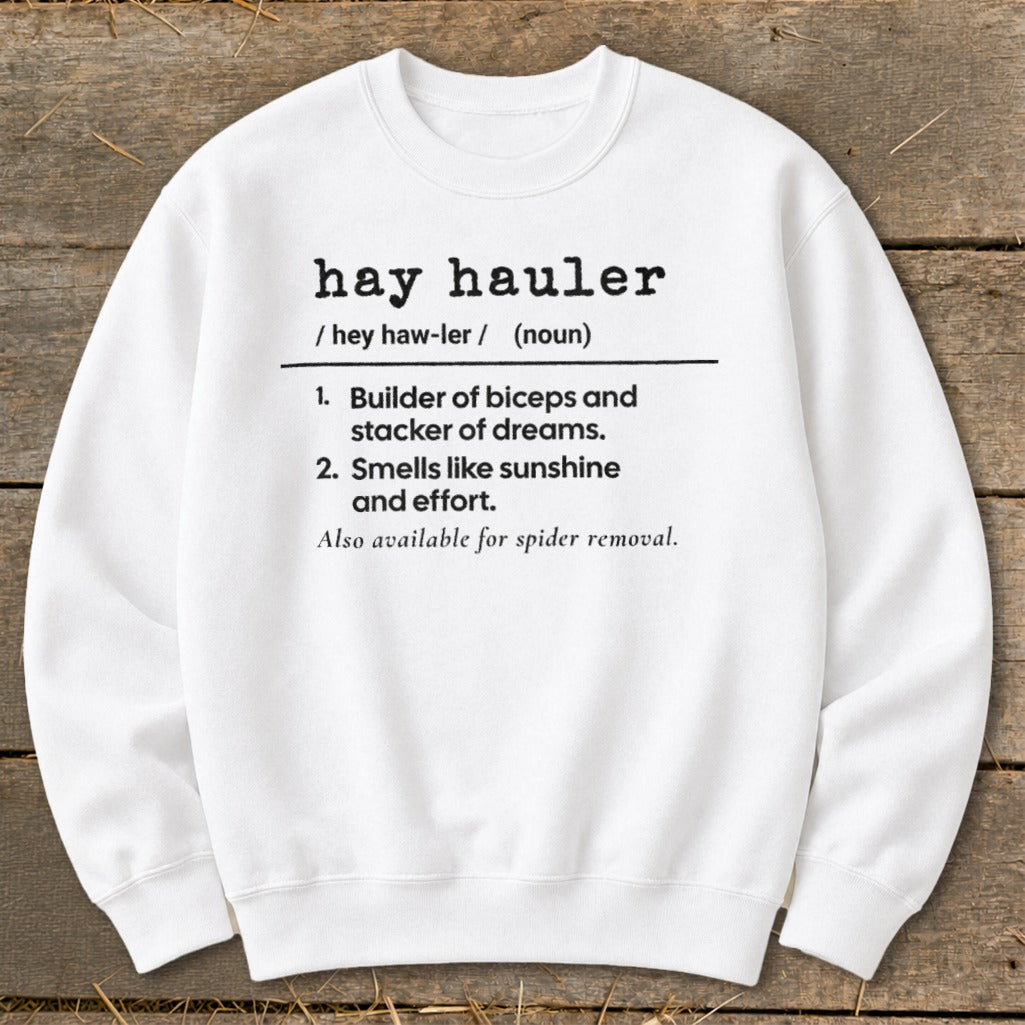 White sweatshirt with definition of "hay hauler" including humorous descriptions.