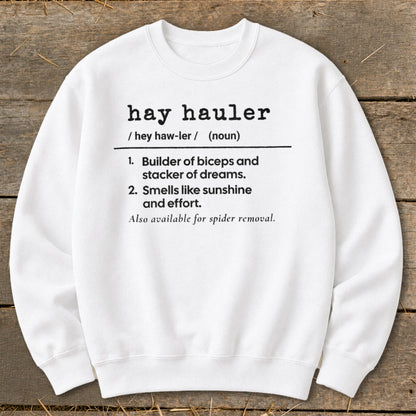White sweatshirt with definition of "hay hauler" including humorous descriptions.