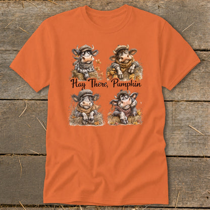 Orange t-shirt with four cartoon cows and "Hay There, Pumpkin" text.