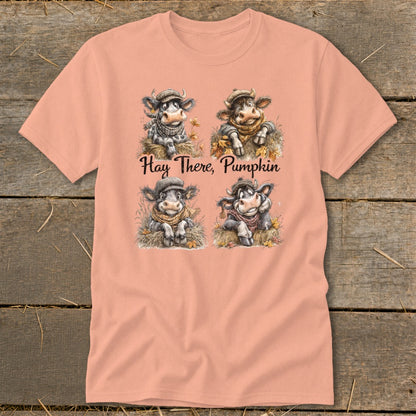 Four cows in hats and scarves sit in hay under the text "Hay There, Pumpkin".