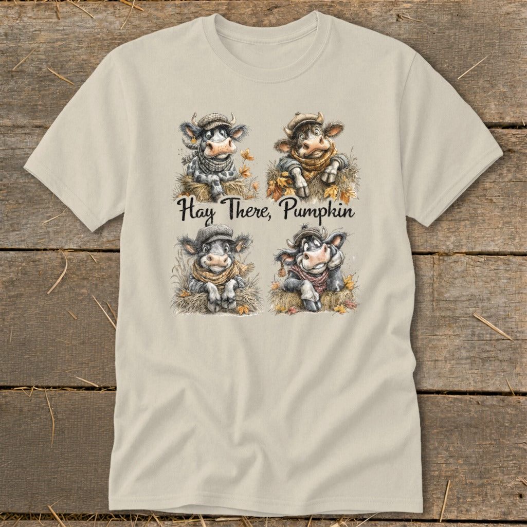 Four cartoon cows wearing scarves and hats with autumn leaves, text "Hay There, Pumpkin."