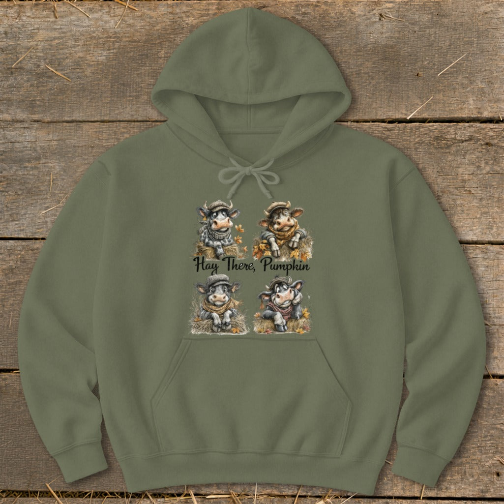 Olive hoodie with four cartoon cows and the text "Hay There, Pumpkin".