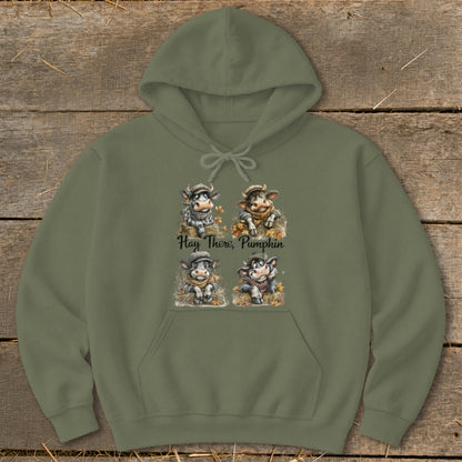 Olive hoodie with four cartoon cows and the text "Hay There, Pumpkin".