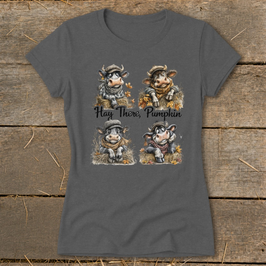 Four cartoon cows wearing hats and scarves with text "Hay There, Pumpkin".