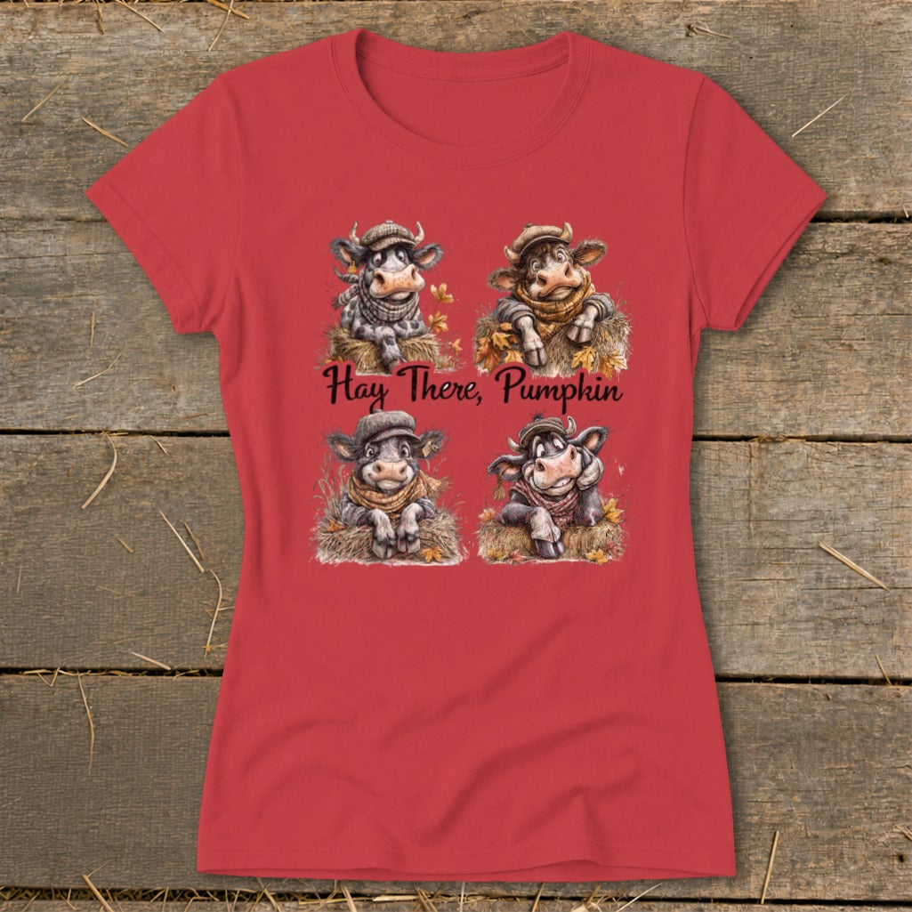 Red t-shirt with four cartoon cows in hats and scarves, reading "Hay There, Pumpkin."