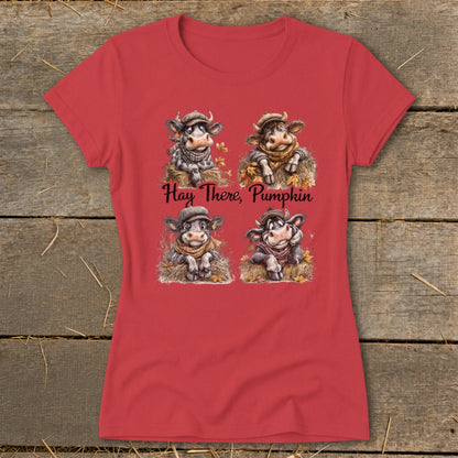 Red t-shirt with four cartoon cows in hats and scarves, reading "Hay There, Pumpkin."