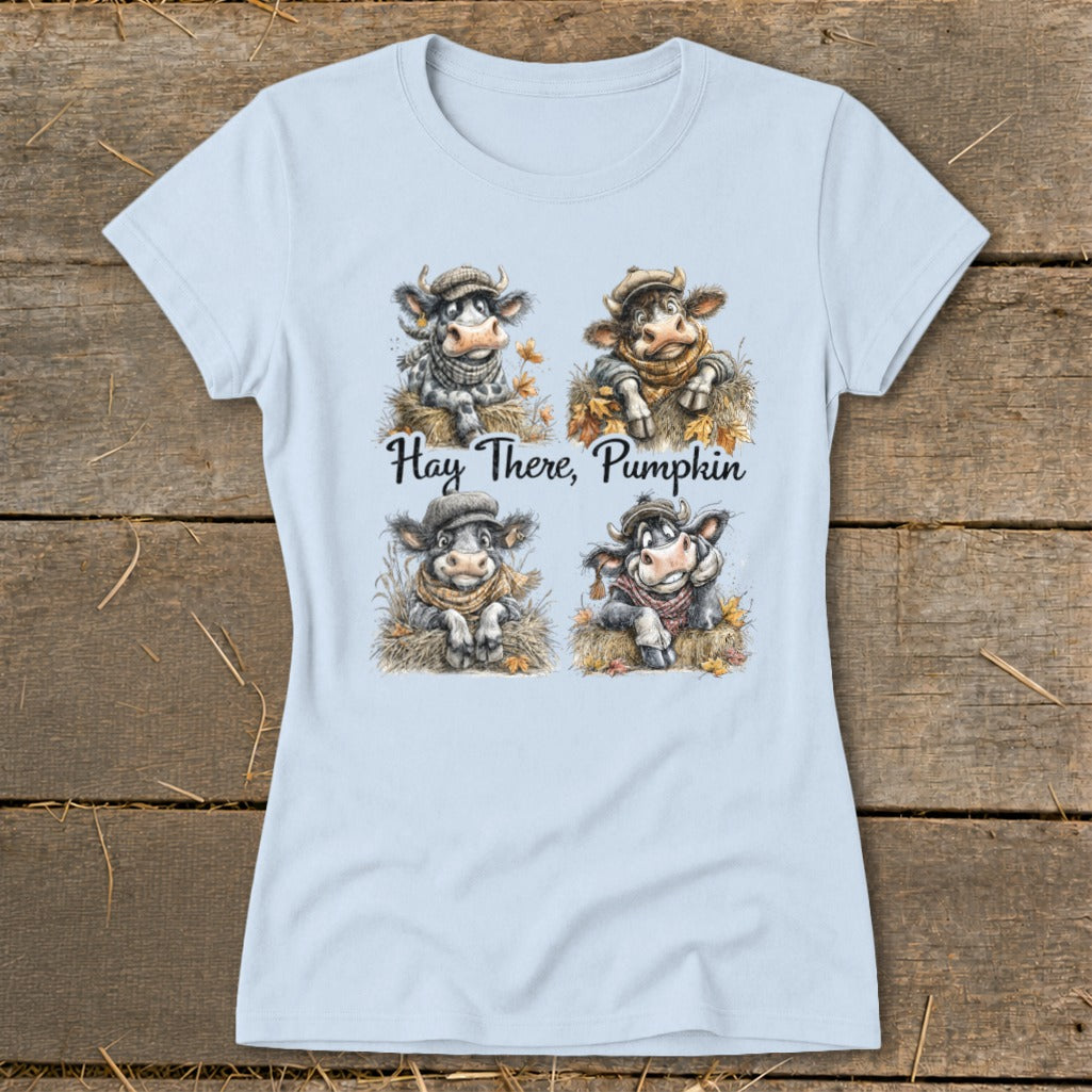 Light blue t-shirt with four cartoon cows and "Hay There, Pumpkin" text.