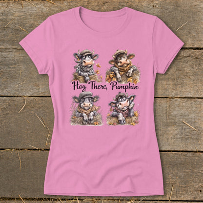 Four cartoon cows wear hats and scarves with text "Hay There, Pumpkin."