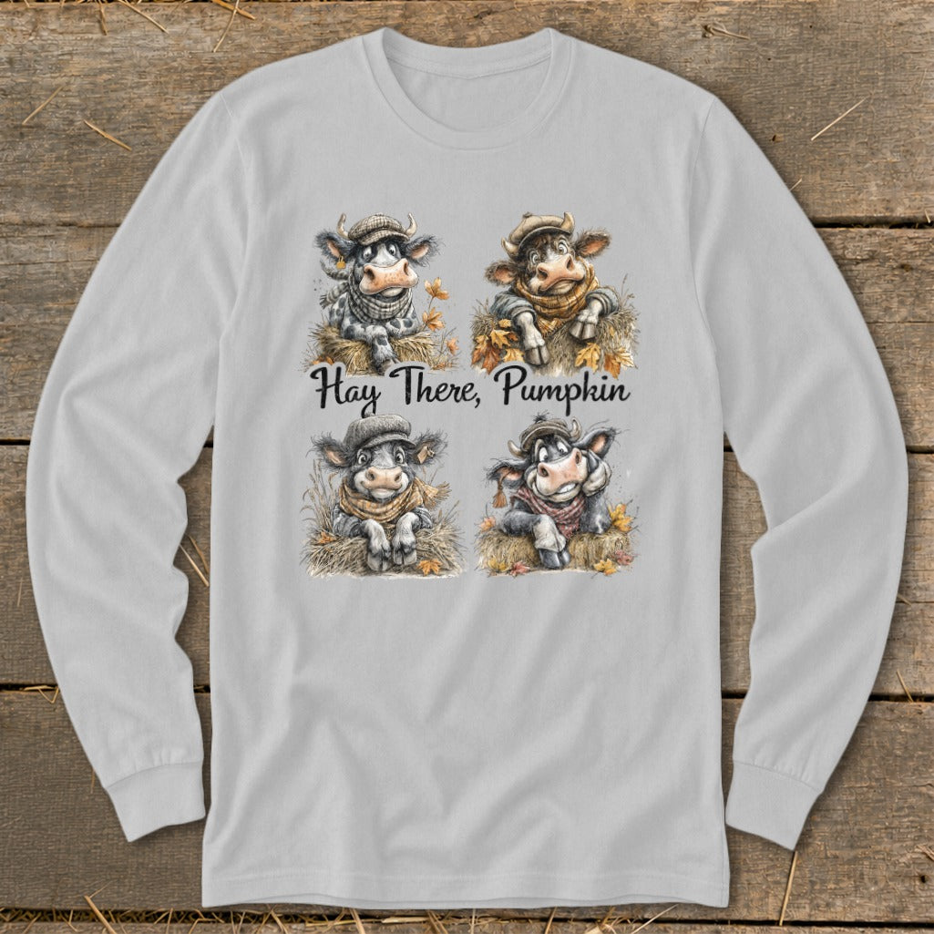 Four illustrated cows wearing scarves and hats with text "Hay There, Pumpkin".