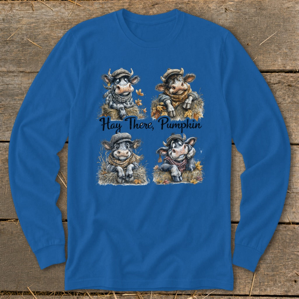 Four cows in hats and scarves sit on hay with text "Hay There, Pumpkin".