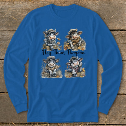 Four cows in hats and scarves sit on hay with text "Hay There, Pumpkin".