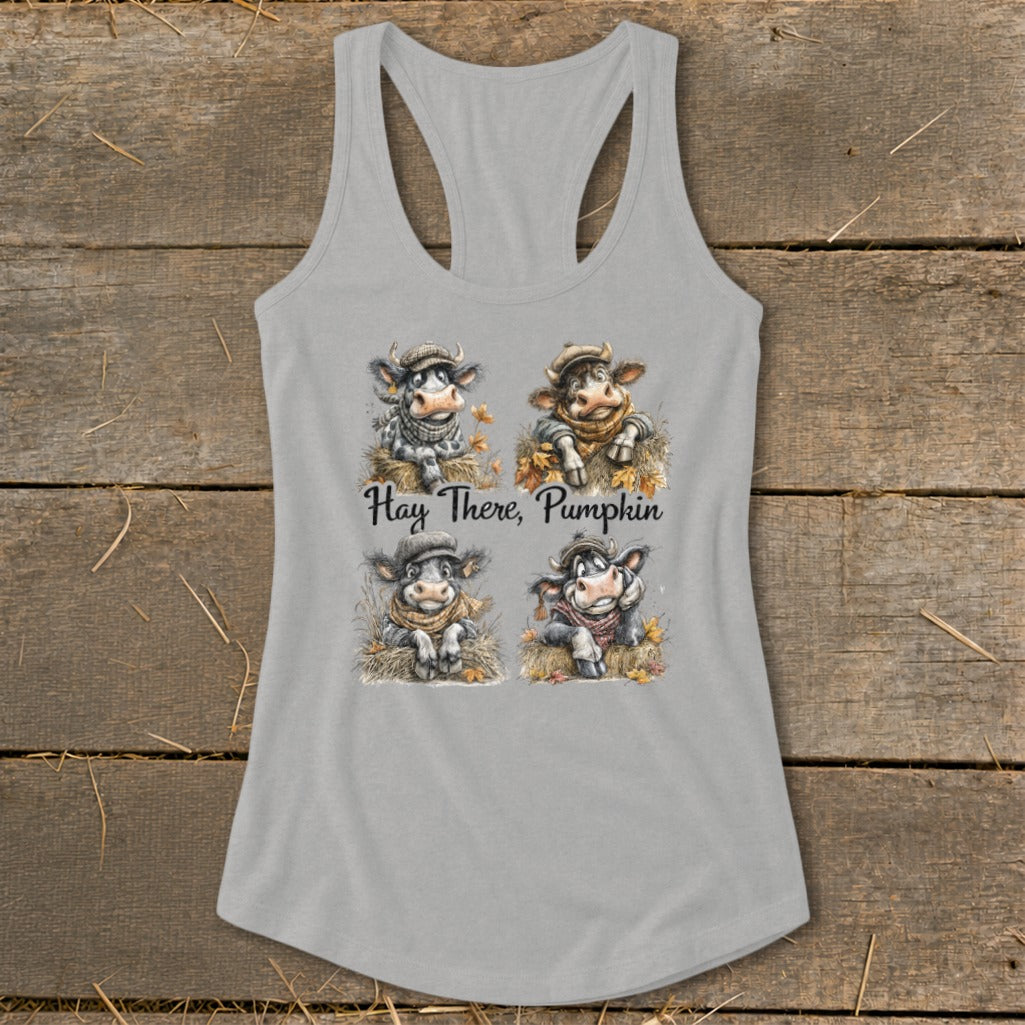 Four cute cows in hats and scarves with text "Hay There, Pumpkin."