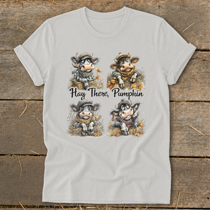Four cartoon cows in hats and scarves with text "Hay There, Pumpkin".