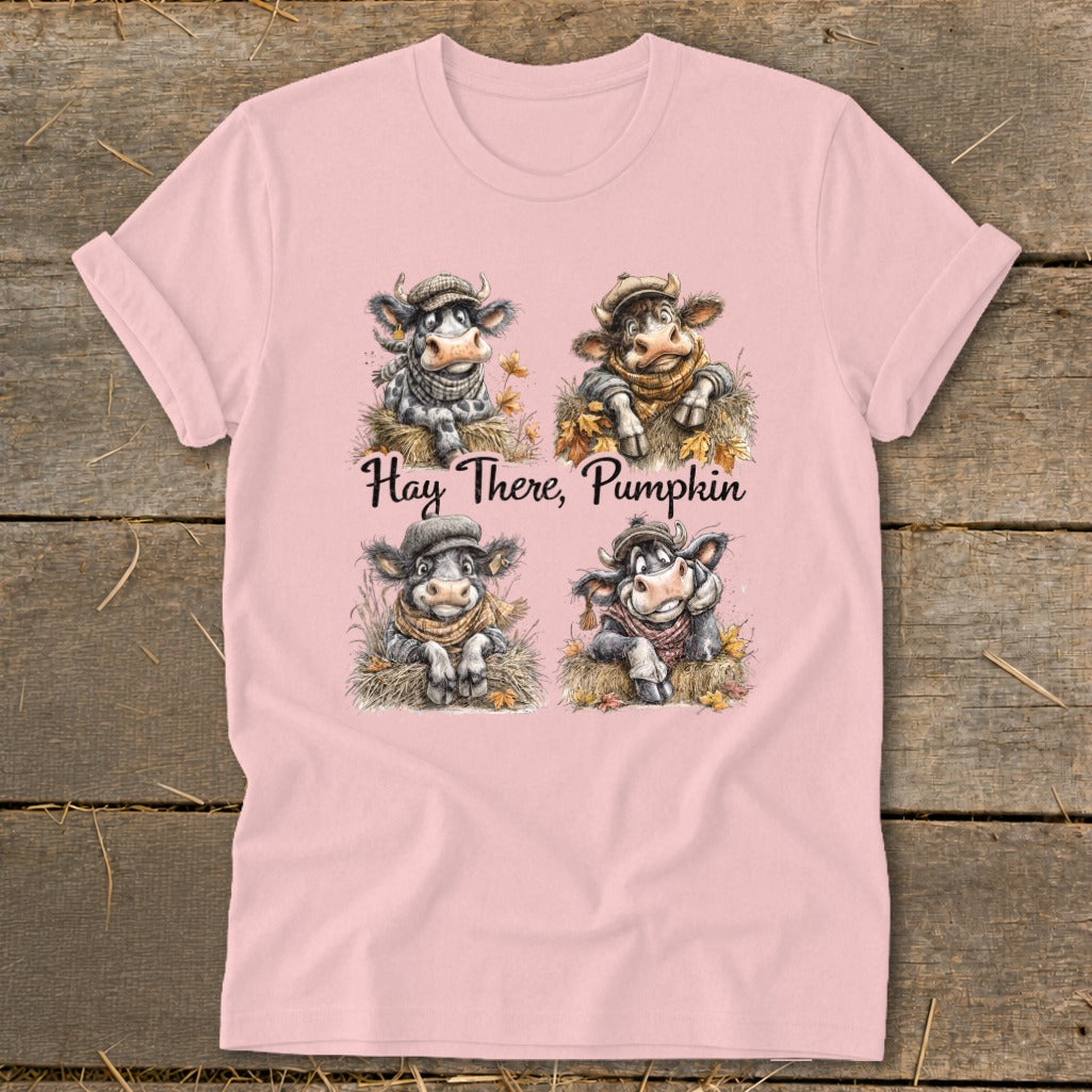 Pink t-shirt with four cartoon cows and text "Hay There, Pumpkin".