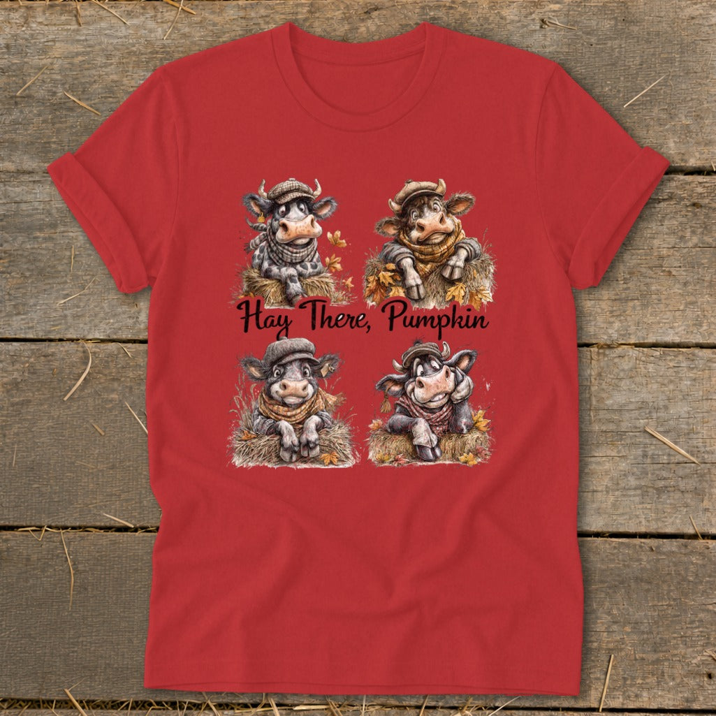Four cute cows in hats and scarves sit in hay, with text "Hay There, Pumpkin".