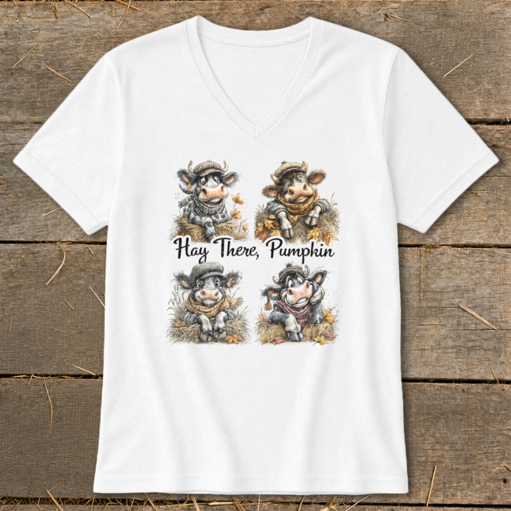 Four cartoon cows with hats and scarves in hay with the text "Hay There, Pumpkin."
