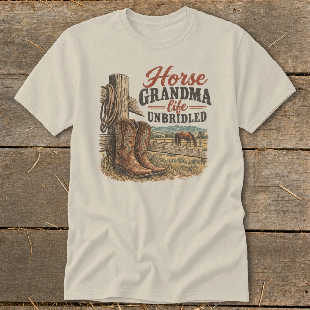 Cream t-shirt featuring a western graphic with cowboy boots, a horse, and the text Horse Grandma Life Unbridled.