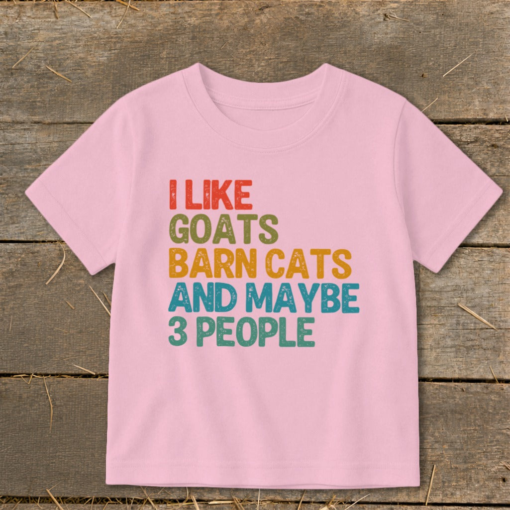 Pink t-shirt with text "I LIKE GOATS BARN CATS AND MAYBE 3 PEOPLE".