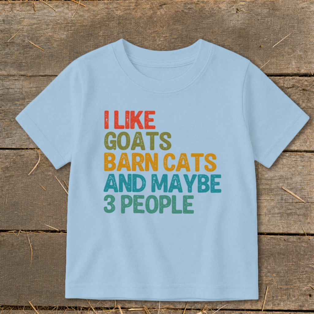 Light blue t-shirt with "I like goats barn cats and maybe 3 people" text.