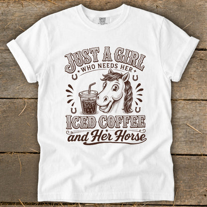 White t-shirt featuring brown text and an illustration of a horse and iced coffee.