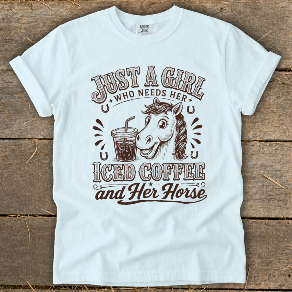 Light blue t-shirt featuring brown text and graphics of a horse with iced coffee.