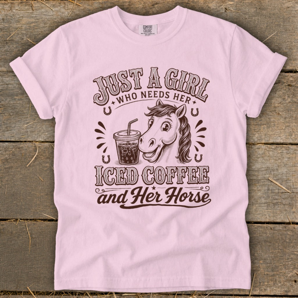 A light pink t-shirt featuring a cartoon horse, an iced coffee, and western-style text.