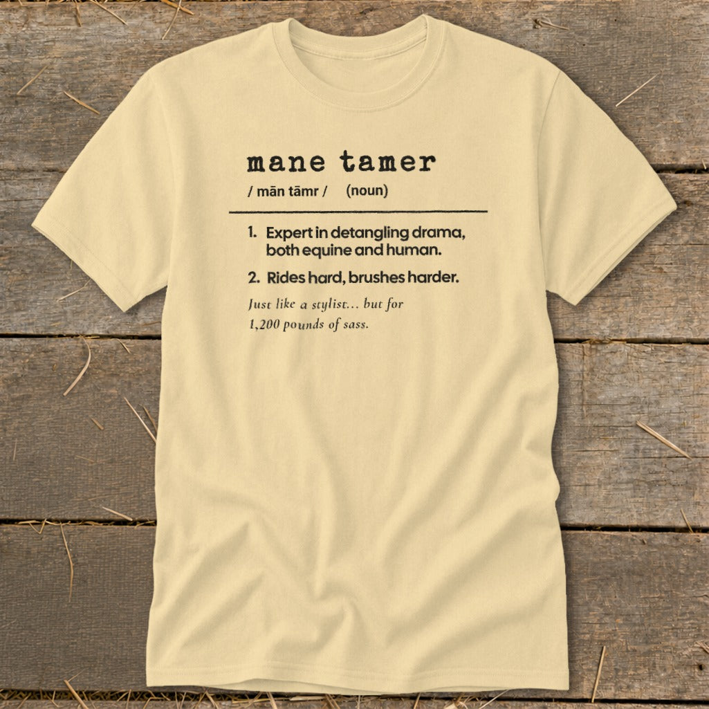 Light yellow t-shirt with "mane tamer" definition about equines and sass.