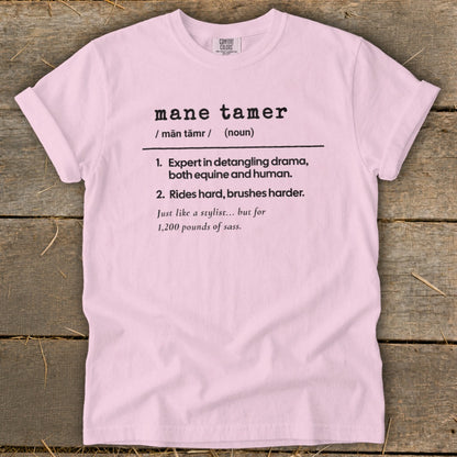 Pink Comfort Colors t-shirt with "mane tamer" definition.