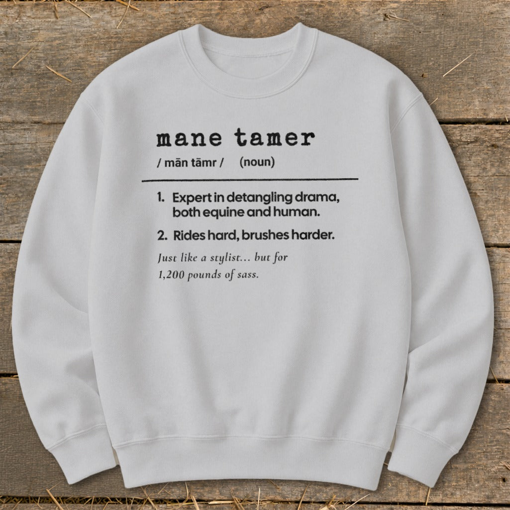 White sweatshirt with "mane tamer" definition in black text.
