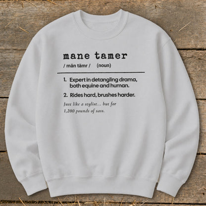 White sweatshirt with "mane tamer" definition in black text.