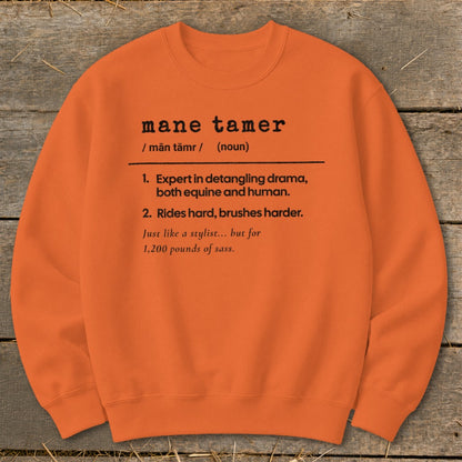 Orange sweatshirt with "mane tamer" definition: expert in detangling drama for equine and human.