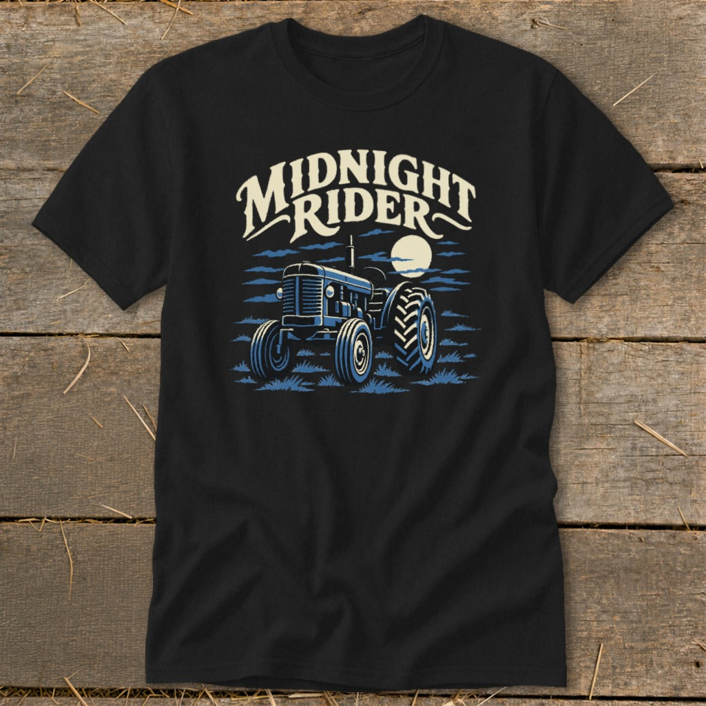 A black t-shirt features a vintage blue tractor graphic with the text Midnight Rider.