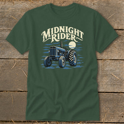 Dark green t-shirt with a graphic of a blue tractor under a full moon and text reading Midnight Rider.
