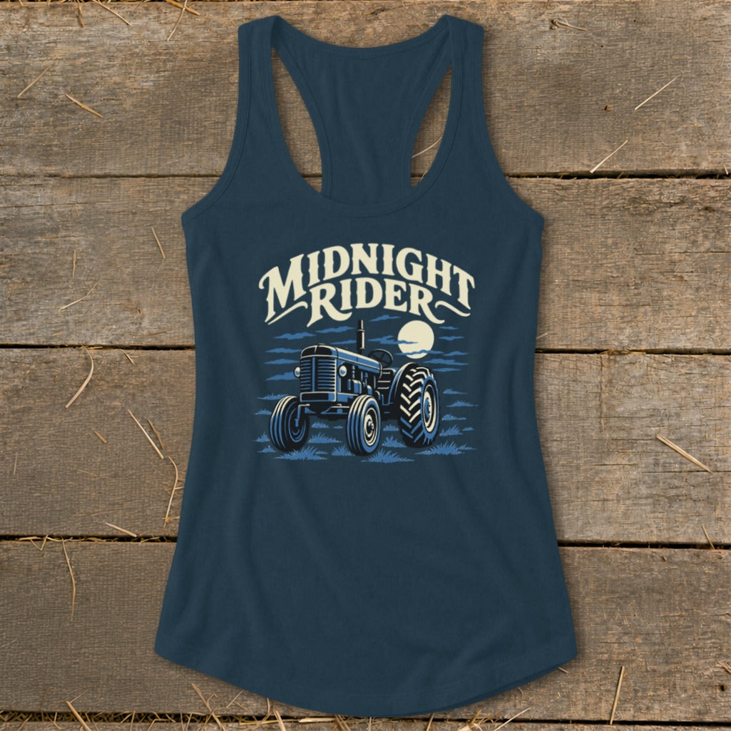 Dark blue racerback tank top featuring a graphic of a tractor under the moon and the text Midnight Rider.