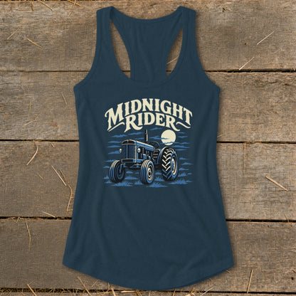 Dark blue racerback tank top featuring a graphic of a tractor under the moon and the text Midnight Rider.