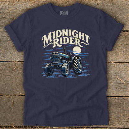 Dark blue t-shirt featuring a graphic of a tractor, a moon, and the text "Midnight Rider."
