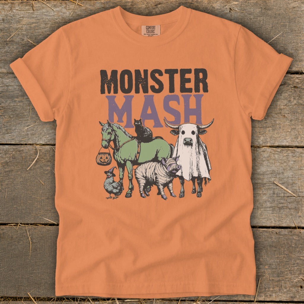 Orange t-shirt with "MONSTER MASH" text and Halloween-themed farm animals graphic.