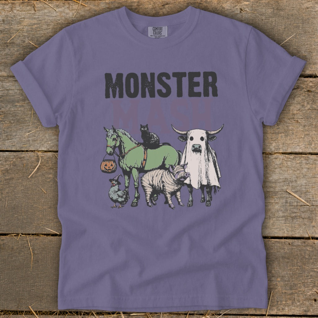T-shirt with "MONSTER" text and cartoon farm animals in Halloween costumes.