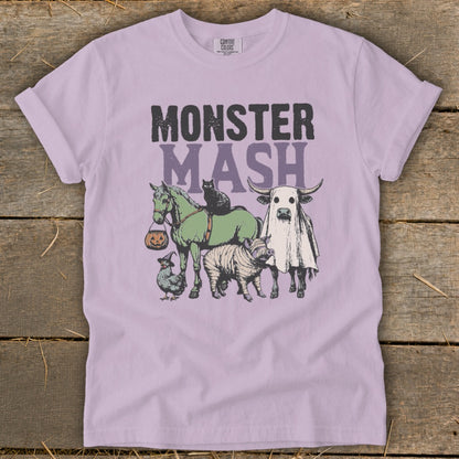 Monster Mash graphic on a light purple t-shirt with various Halloween-themed animals.