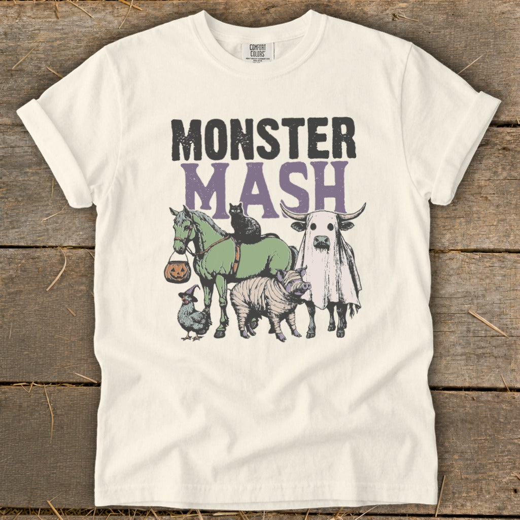 Cream t-shirt with "Monster Mash" text and illustrated Halloween animals.