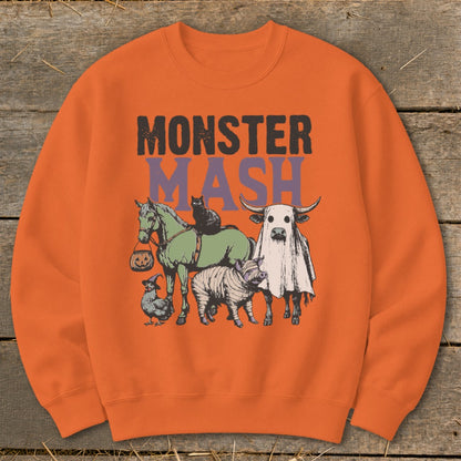 Orange sweatshirt with "Monster Mash" text and cartoon animals in Halloween costumes.