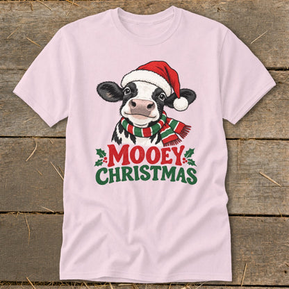 Pink t-shirt with a cow wearing a Santa hat and scarf, text "Mooey Christmas."