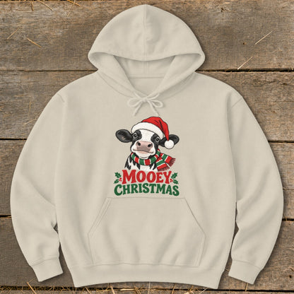 Cream hoodie with a cartoon cow wearing a Santa hat and scarf, saying "Mooey Christmas."
