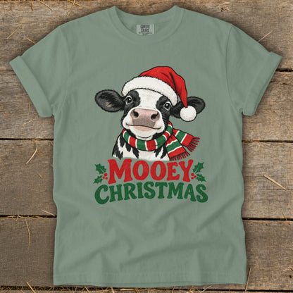T-shirt with festive cow wearing Santa hat and scarf, text "Mooey Christmas".