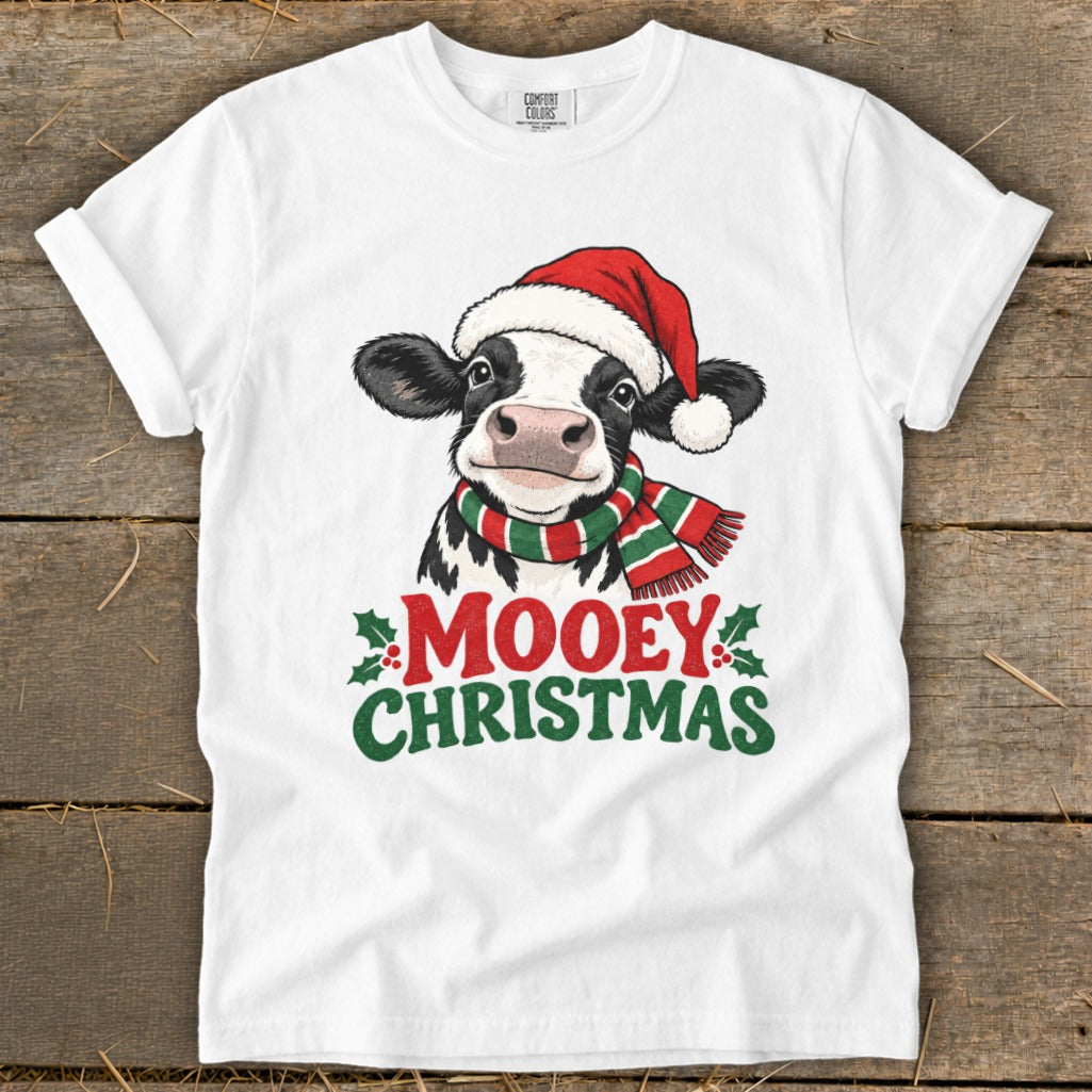 White t-shirt with a cow wearing a Santa hat and scarf, text "MOOEY CHRISTMAS".