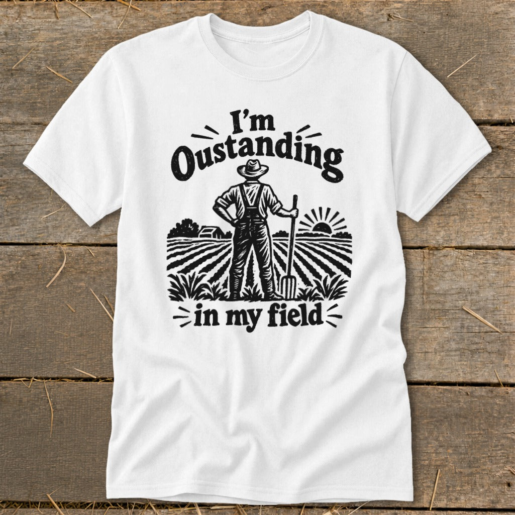 White t-shirt with "I'm Oustanding in my field" text and farmer graphic.