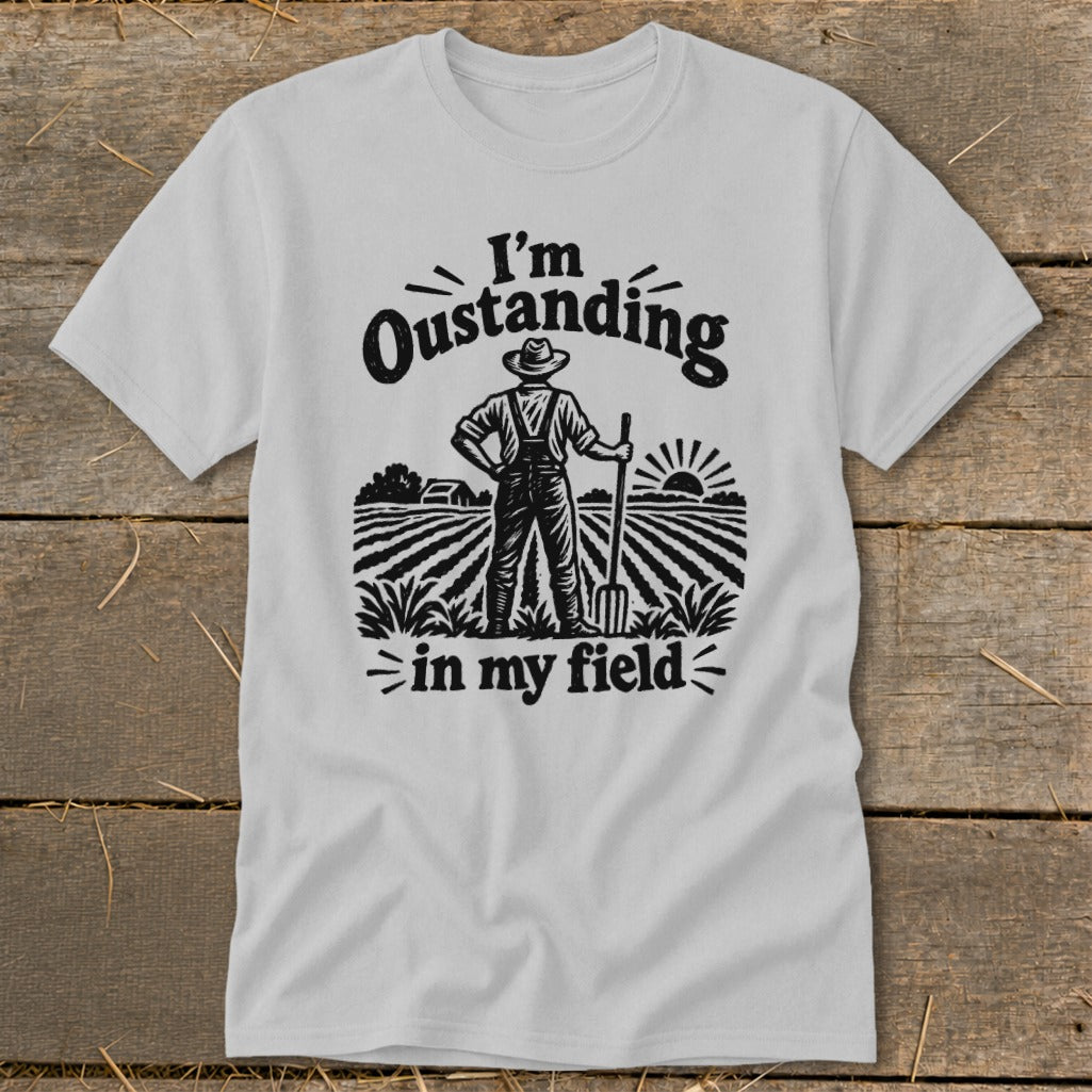Gray t-shirt with "I'm Oustanding in my field" text and farmer graphic.